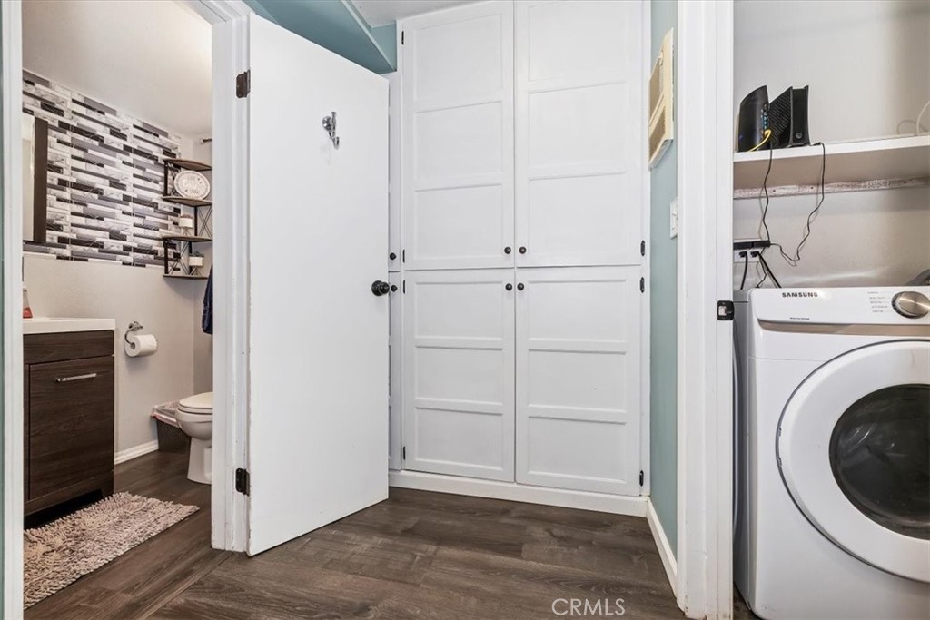 737 Edgar Avenue Beaumont, CA 92223 - Photo 20 of 43 a view of a hallway with washer and dryer