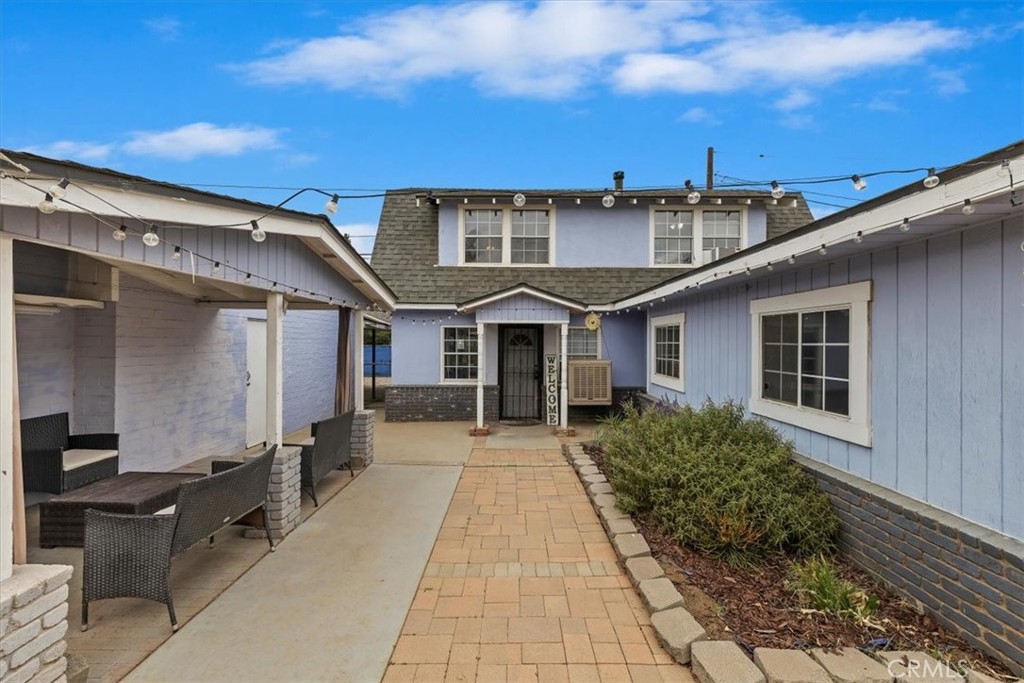 737 Edgar Avenue Beaumont, CA 92223 - Photo 2 of 43 a front view of a house with garden