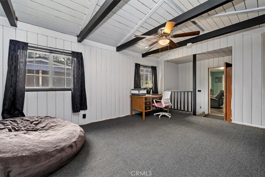 737 Edgar Avenue Beaumont, CA 92223 - Photo 24 of 43 a view of a bedroom with furniture and a window