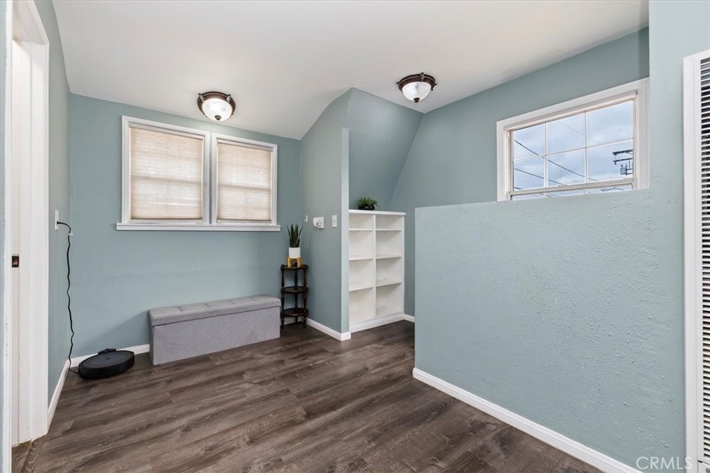 737 Edgar Avenue Beaumont, CA 92223 - Photo 25 of 43 an empty room with wooden floor and window