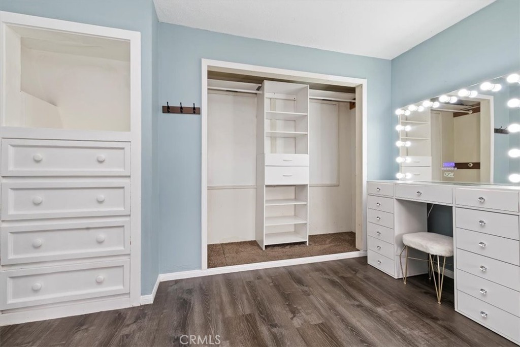 737 Edgar Avenue Beaumont, CA 92223 - Photo 31 of 43 a view of room with wooden floor and cabinet
