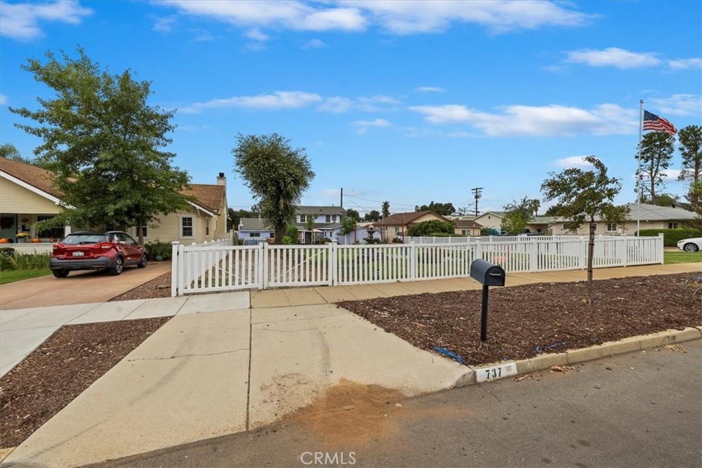 737 Edgar Avenue Beaumont, CA 92223 - Photo 36 of 43 a view of a street with a cars parked