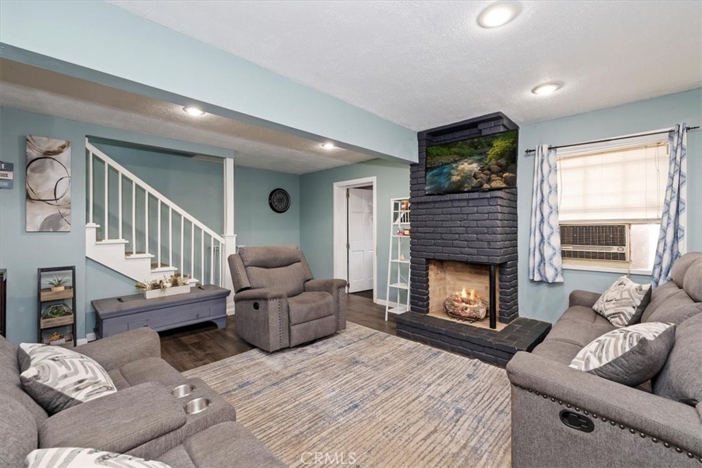 737 Edgar Avenue Beaumont, CA 92223 - Photo 8 of 43 a living room with furniture and a fireplace