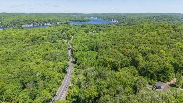 a view of a field of grass and white house
