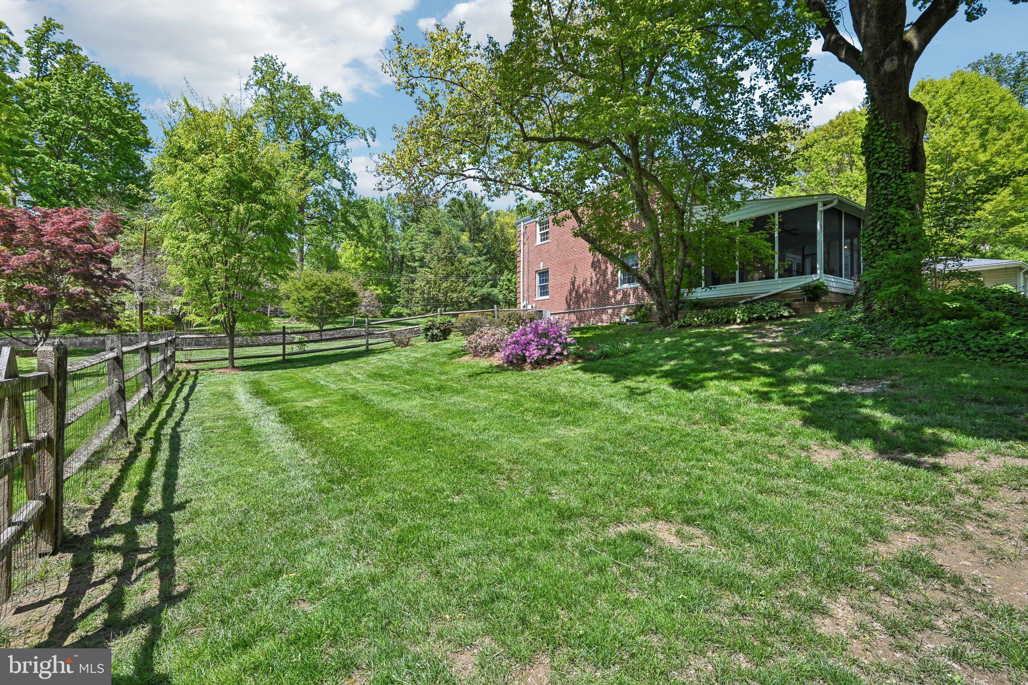 263 South Roberts Road Bryn Mawr, PA 19010 - Photo 52 of 74 Lush green yard with vibrant blooms.