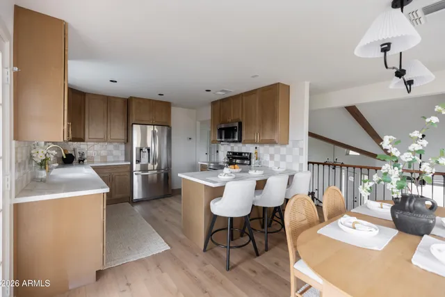 a view of a dining room with furniture and window