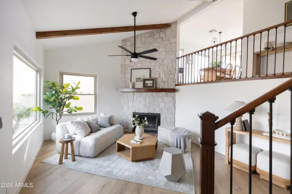 a living room with furniture and a fireplace