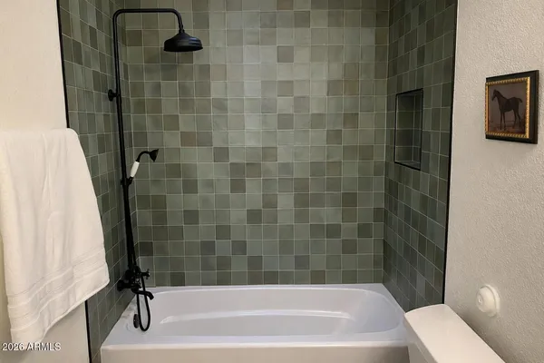 a view of a balcony with furniture