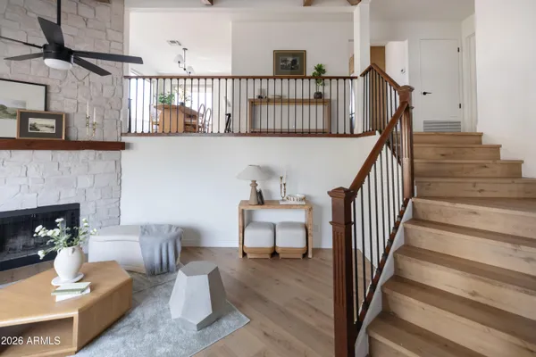 a view of entryway and hall with wooden floor