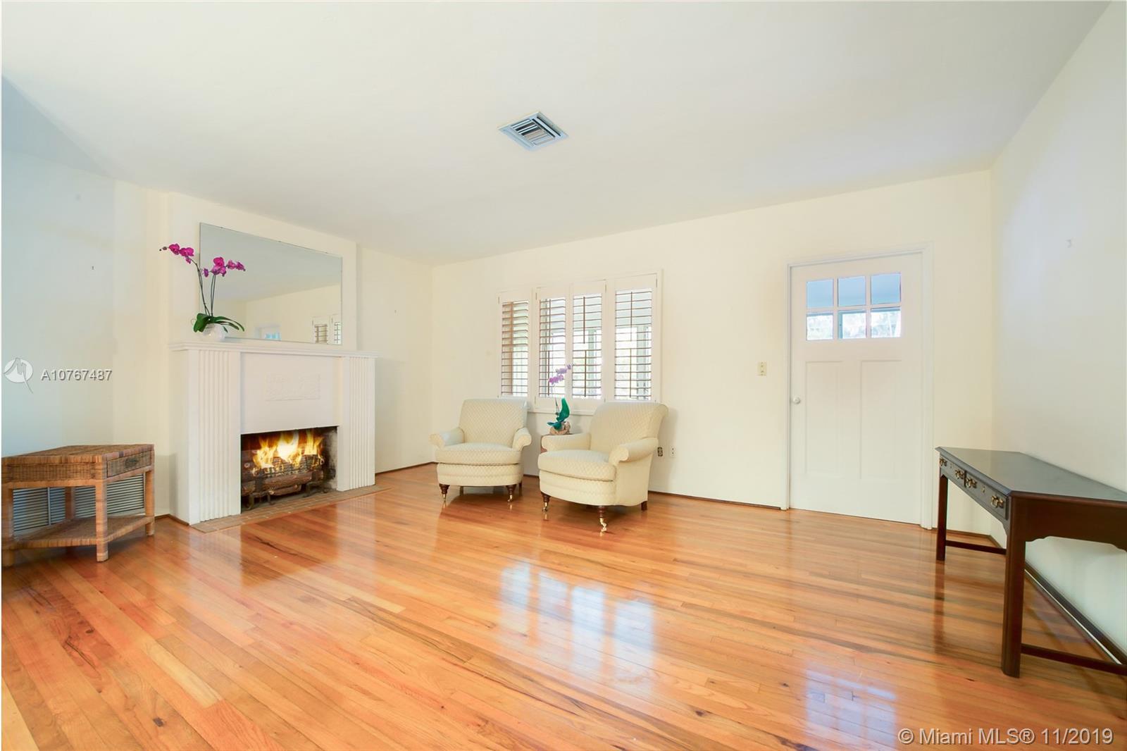4010 Woodridge Road Miami, FL 33133 - Photo 2 of 12 Living Room With Wood-Burning Fireplace