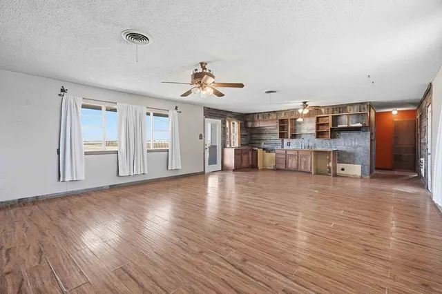 a view of a livingroom with a furniture and wooden floor