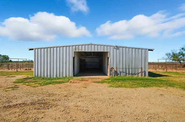 a view of a backyard of the house