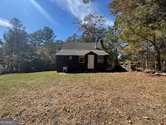 902 Pinyan Road Southeast Ranger, GA 30734 - Photo 11 of 60 a front view of a house with a yard and garage