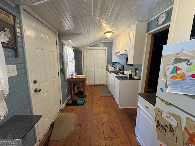 902 Pinyan Road Southeast Ranger, GA 30734 - Photo 13 of 60 a kitchen with stainless steel appliances a refrigerator a sink a stove and white cabinets