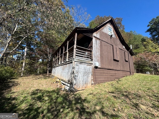 902 Pinyan Road Southeast Ranger, GA 30734 - Photo 9 of 60 a view of wooden house with a yard