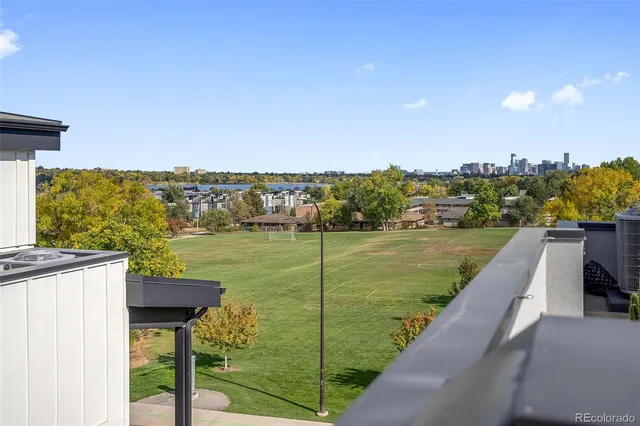 a view of a kitchen with a sink and cabinets