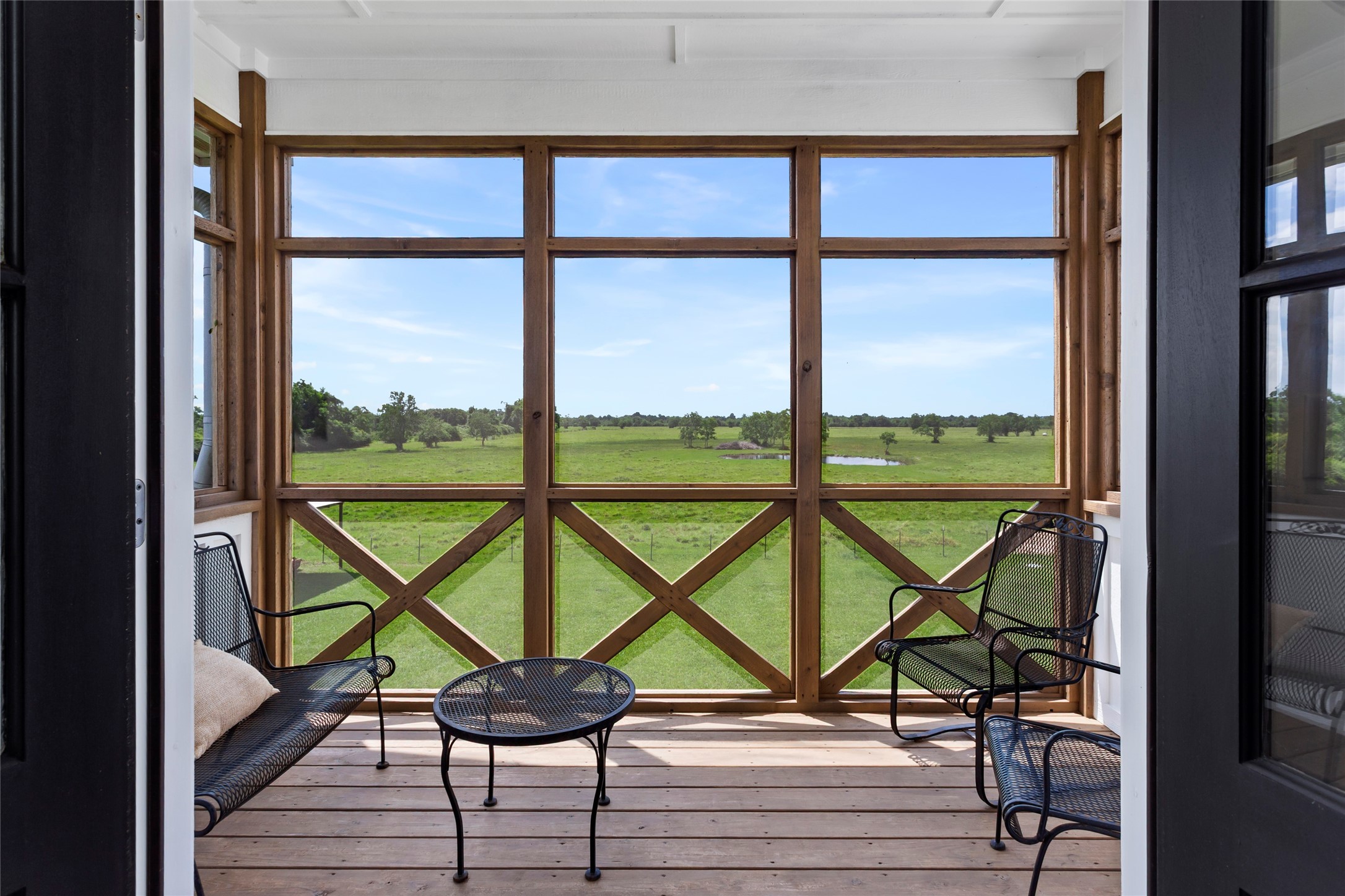 4473 County Road 172 Alvin, TX 77511 - Photo 23 of 36 Enjoy gorgeous country views on your screened in balcony off of the primary bedroom