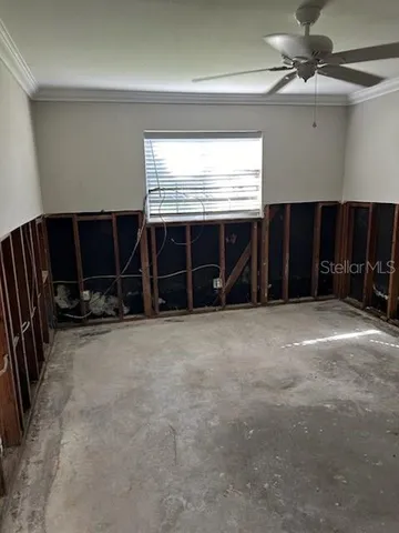 a view of a livingroom with furniture and a window