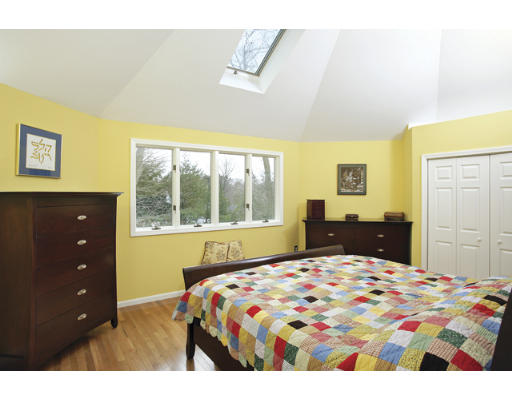166 Ridge Avenue Newton, MA 02459 - Photo 7 of 9 a bedroom with a bed and a dresser