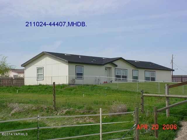 1822 Gap Road Granger, WA 98932 - Photo 1 of 1 a view of a house with a yard