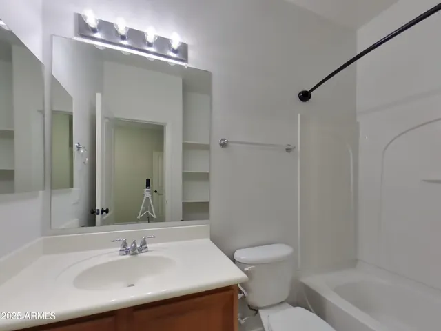 a view of room with windows and closet