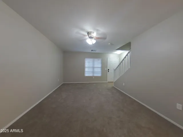 a view of empty room with a fireplace