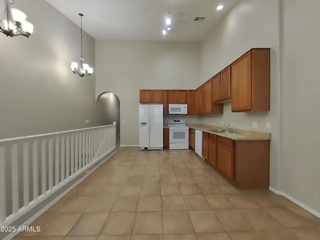 a view of an empty room and wooden floor