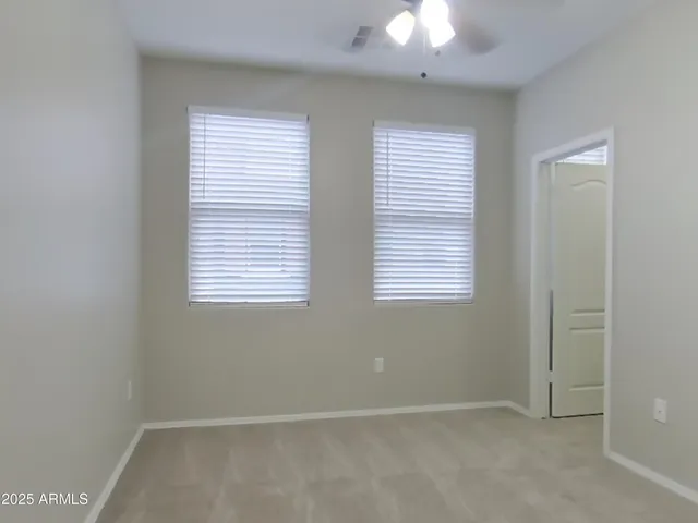 a bathroom with a granite countertop toilet and a shower