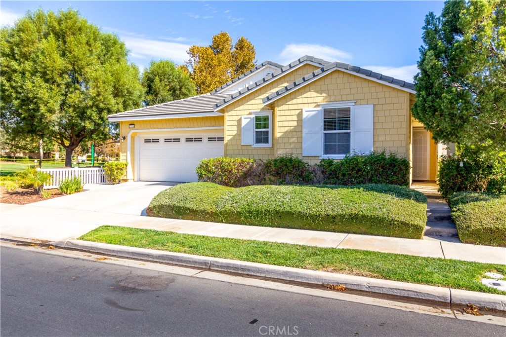 27336 Brandon Lane Temecula, CA 92591 - Photo 1 of 49 a front view of a house with a yard and garage