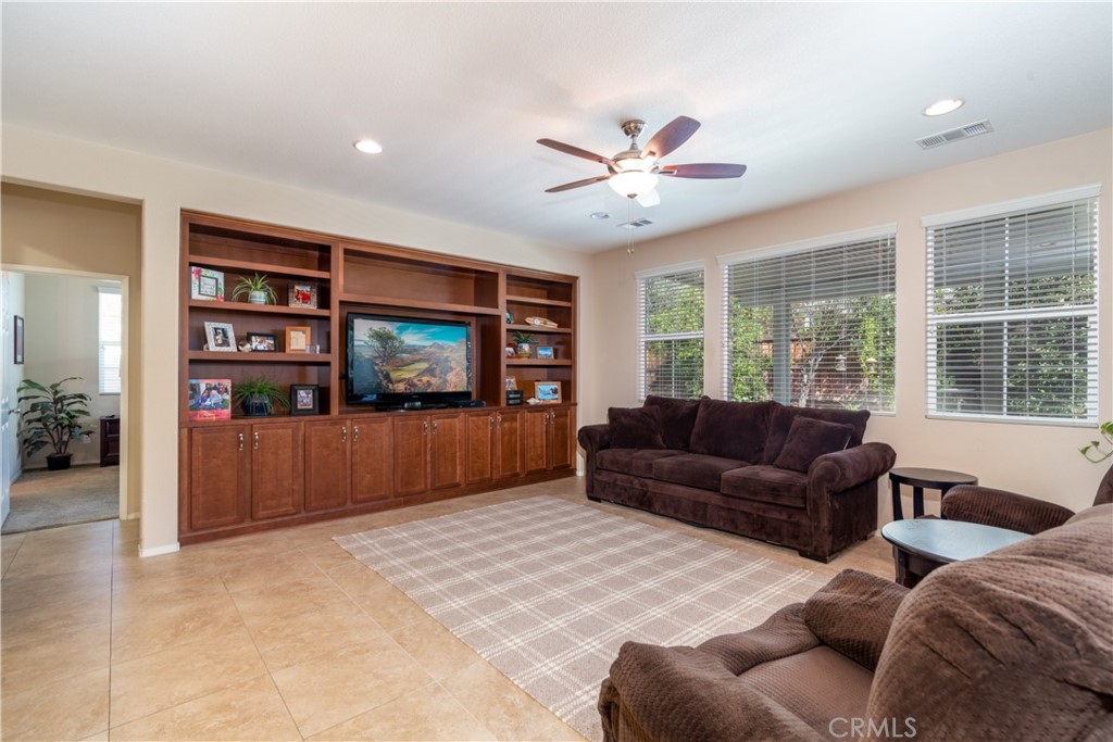 27336 Brandon Lane Temecula, CA 92591 - Photo 15 of 49 a living room with furniture and a flat screen tv