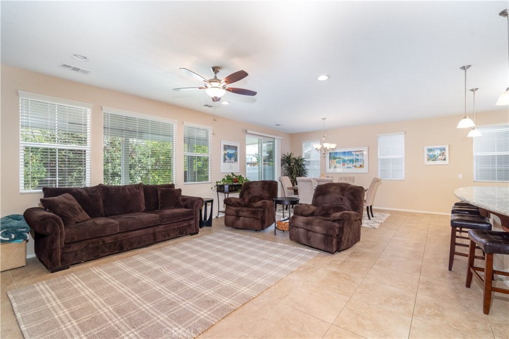 27336 Brandon Lane Temecula, CA 92591 - Photo 16 of 49 a living room with furniture ceiling fan and a window