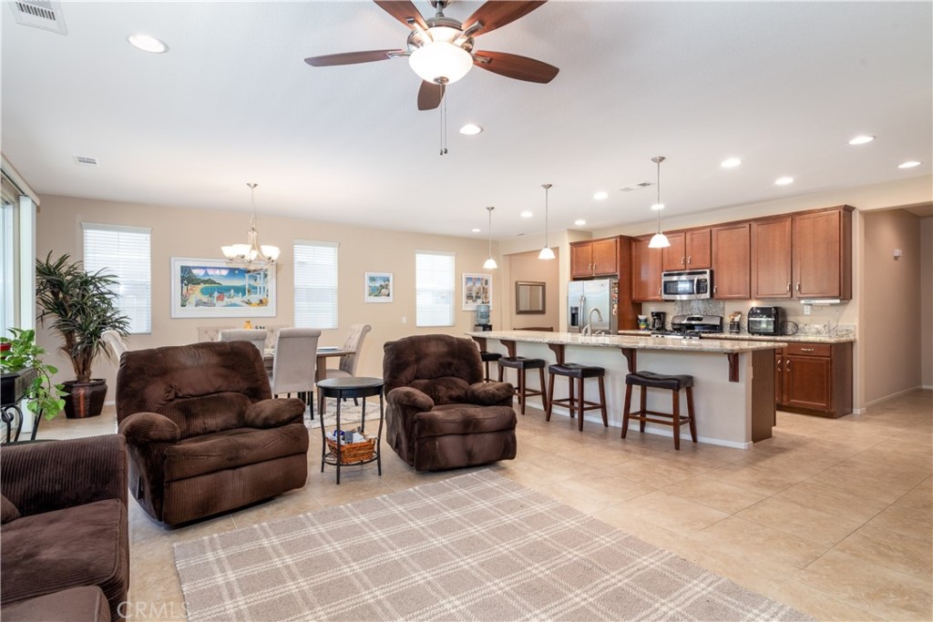 27336 Brandon Lane Temecula, CA 92591 - Photo 17 of 49 a living room with furniture kitchen view and a potted plant