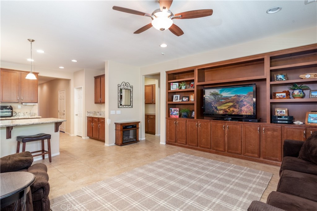 27336 Brandon Lane Temecula, CA 92591 - Photo 18 of 49 a living room with furniture and a flat screen tv