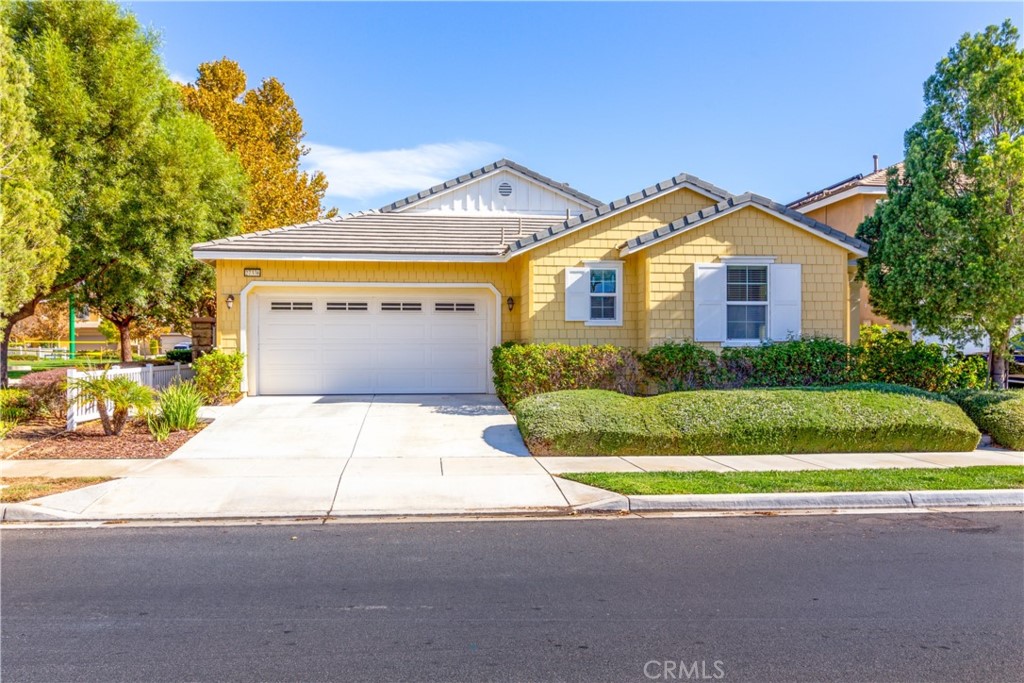27336 Brandon Lane Temecula, CA 92591 - Photo 2 of 49 a front view of a house with a yard and garage
