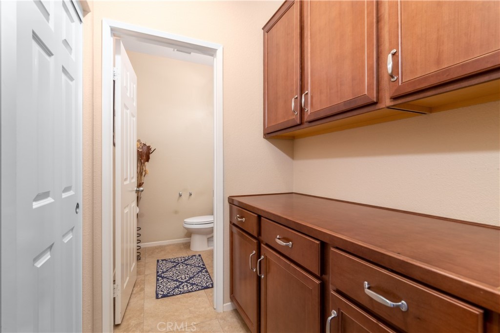 27336 Brandon Lane Temecula, CA 92591 - Photo 22 of 49 a view of a hallway with toilet