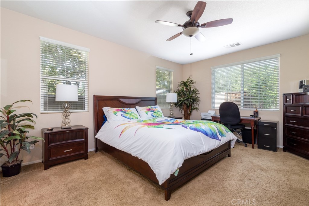 27336 Brandon Lane Temecula, CA 92591 - Photo 24 of 49 a bedroom with a bed and ceiling fan