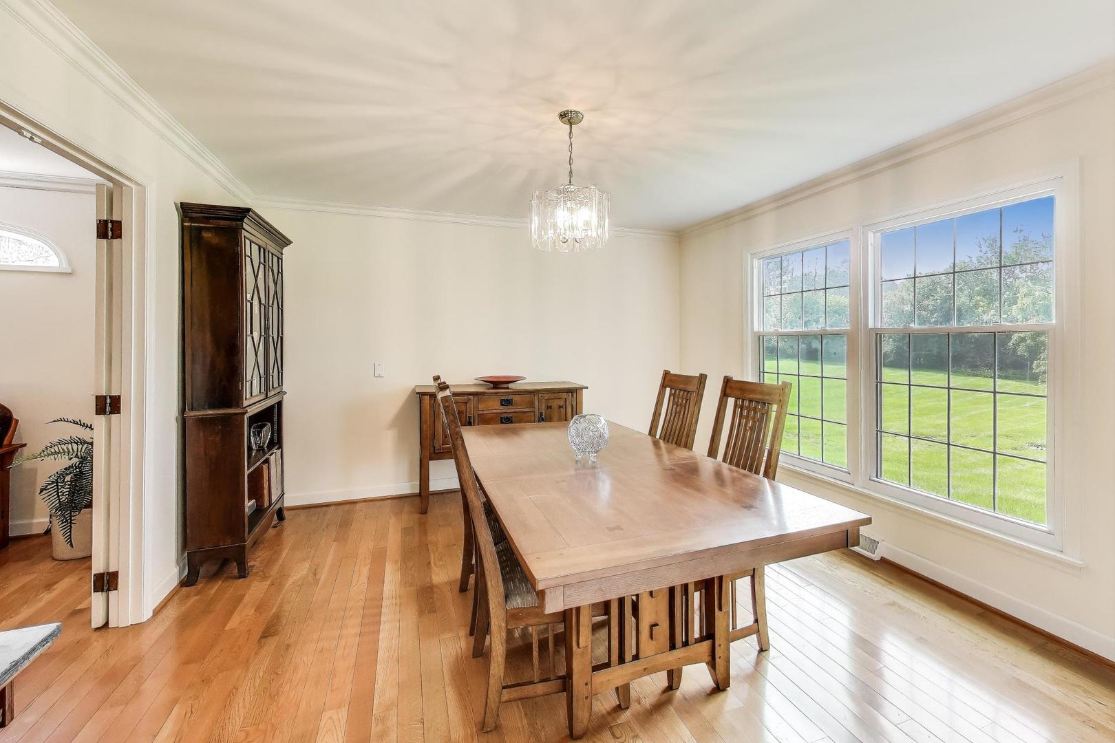 25839 West Sunset Road Barrington, IL 60010 - Photo 11 of 54 a view of a dining room with furniture window and wooden floor
