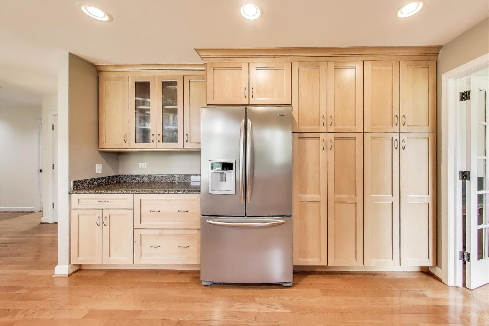 25839 West Sunset Road Barrington, IL 60010 - Photo 14 of 54 a kitchen with stainless steel appliances granite countertop a refrigerator and a stove top oven