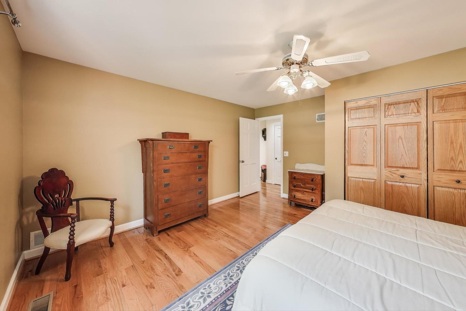 25839 West Sunset Road Barrington, IL 60010 - Photo 21 of 54 a bedroom with furniture and wooden floor
