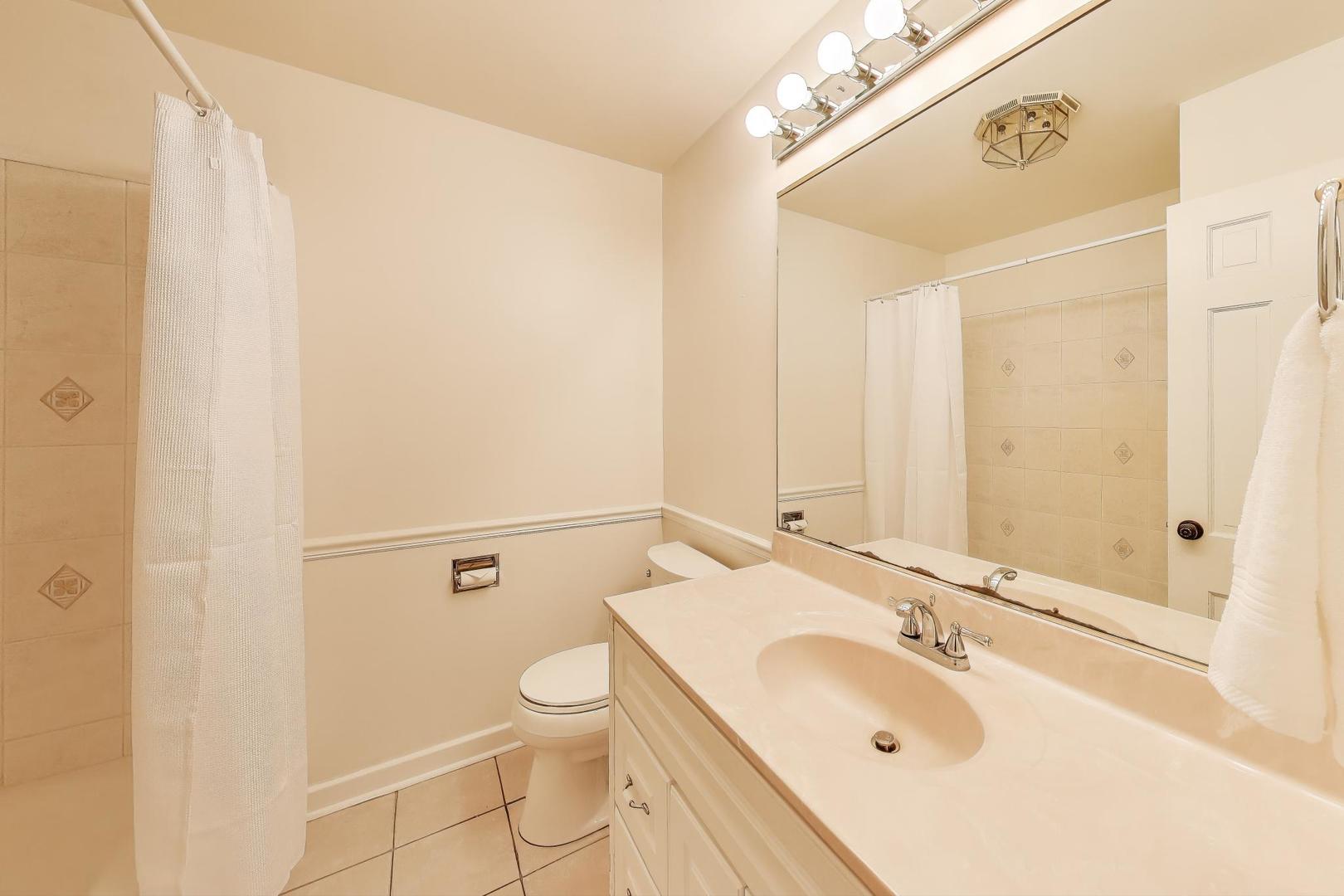 25839 West Sunset Road Barrington, IL 60010 - Photo 22 of 54 a bathroom with a sink mirror vanity and toilet