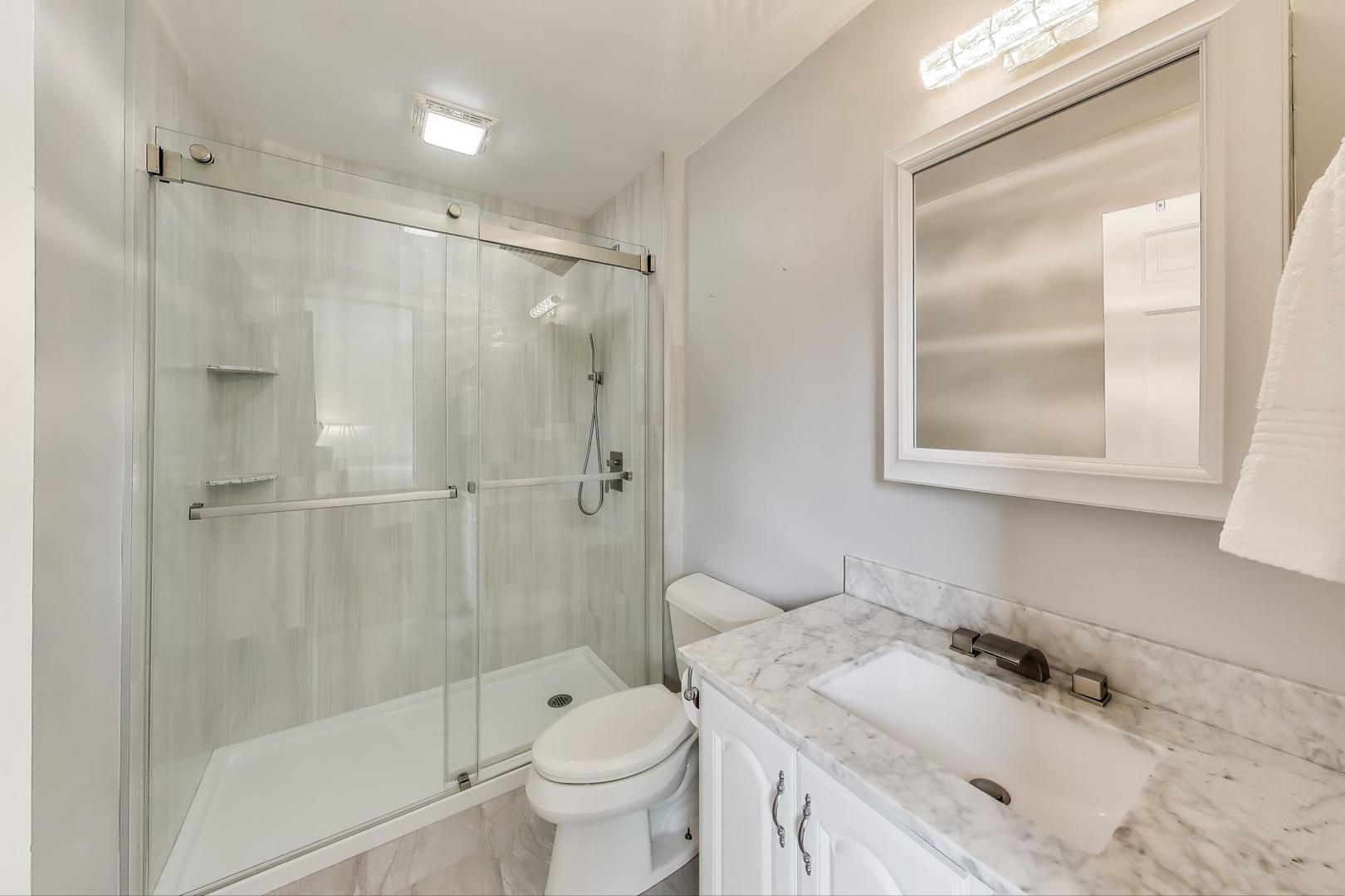 25839 West Sunset Road Barrington, IL 60010 - Photo 25 of 54 a bathroom with a sink toilet and shower