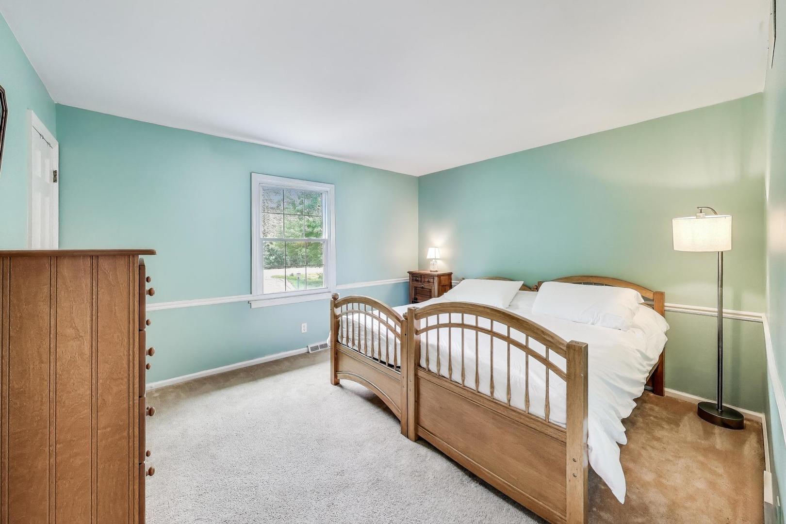 25839 West Sunset Road Barrington, IL 60010 - Photo 28 of 54 a bedroom with a bed and a window