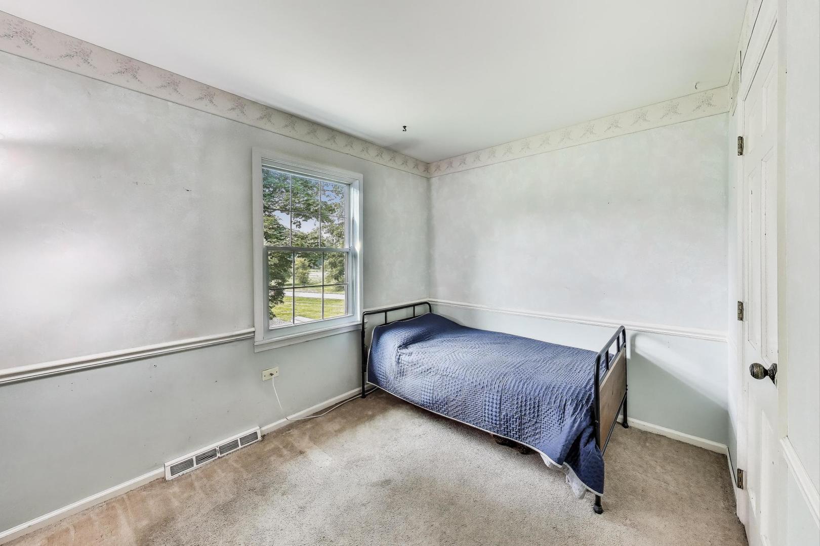 25839 West Sunset Road Barrington, IL 60010 - Photo 29 of 54 a bedroom with a bed and window