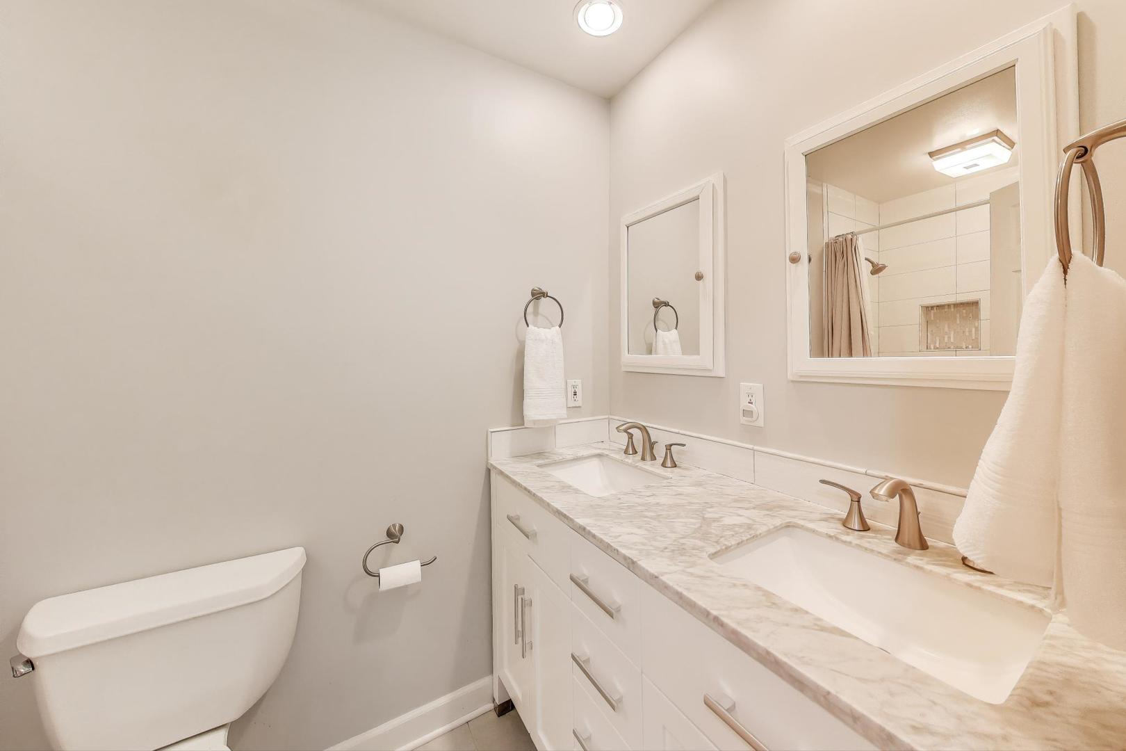 25839 West Sunset Road Barrington, IL 60010 - Photo 30 of 54 a bathroom with a granite countertop toilet sink and mirror