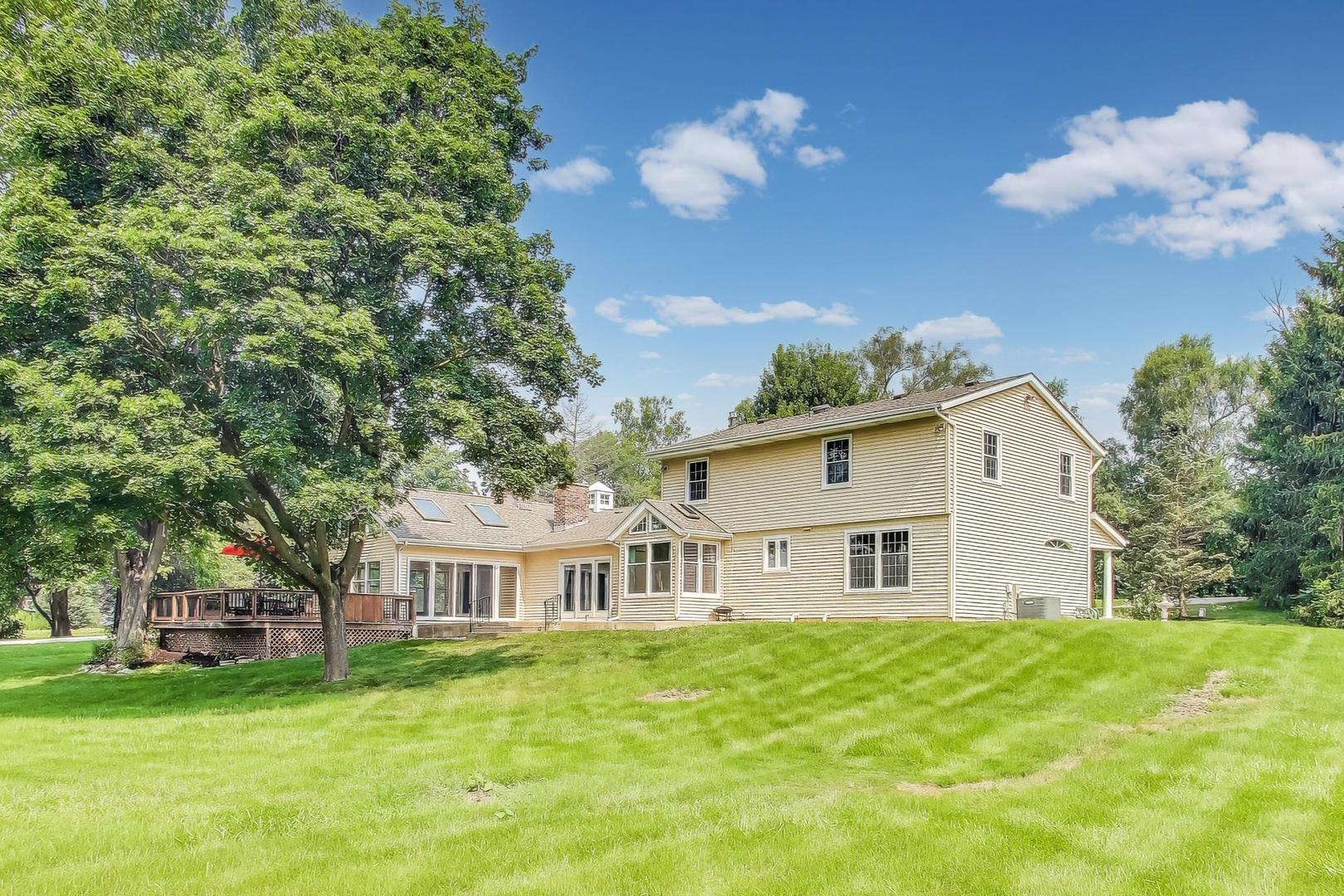 25839 West Sunset Road Barrington, IL 60010 - Photo 3 of 54 a view of a house with a big yard