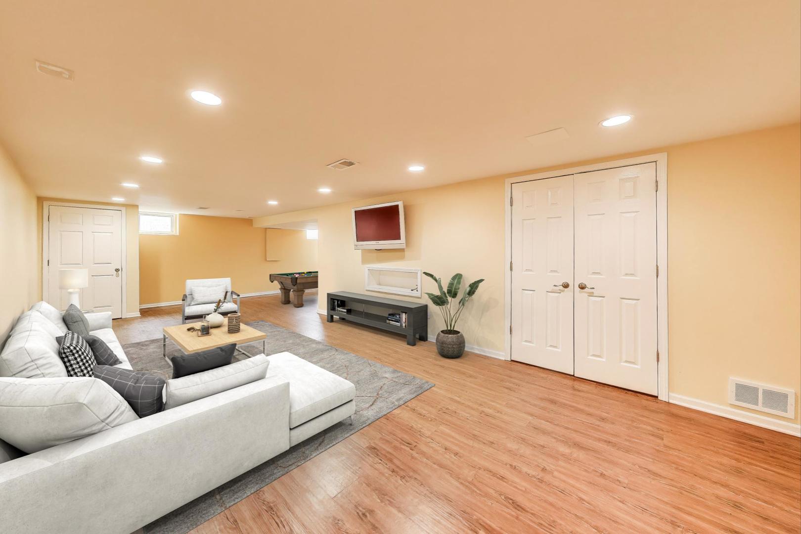25839 West Sunset Road Barrington, IL 60010 - Photo 32 of 54 a living room with furniture and a wooden floor