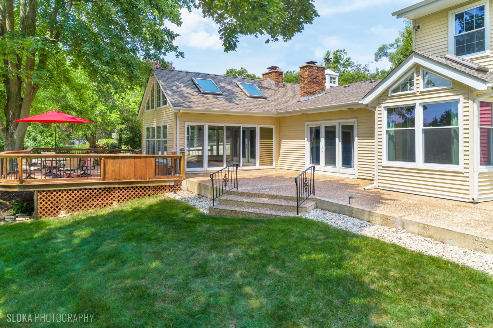 25839 West Sunset Road Barrington, IL 60010 - Photo 39 of 54 a view of a house with a yard and sitting area