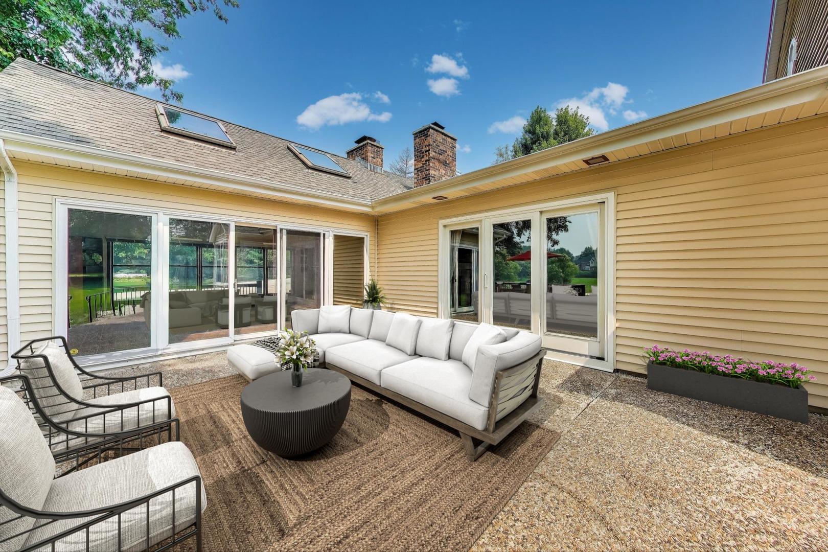 25839 West Sunset Road Barrington, IL 60010 - Photo 40 of 54 a view of a patio with couches chairs and potted plants