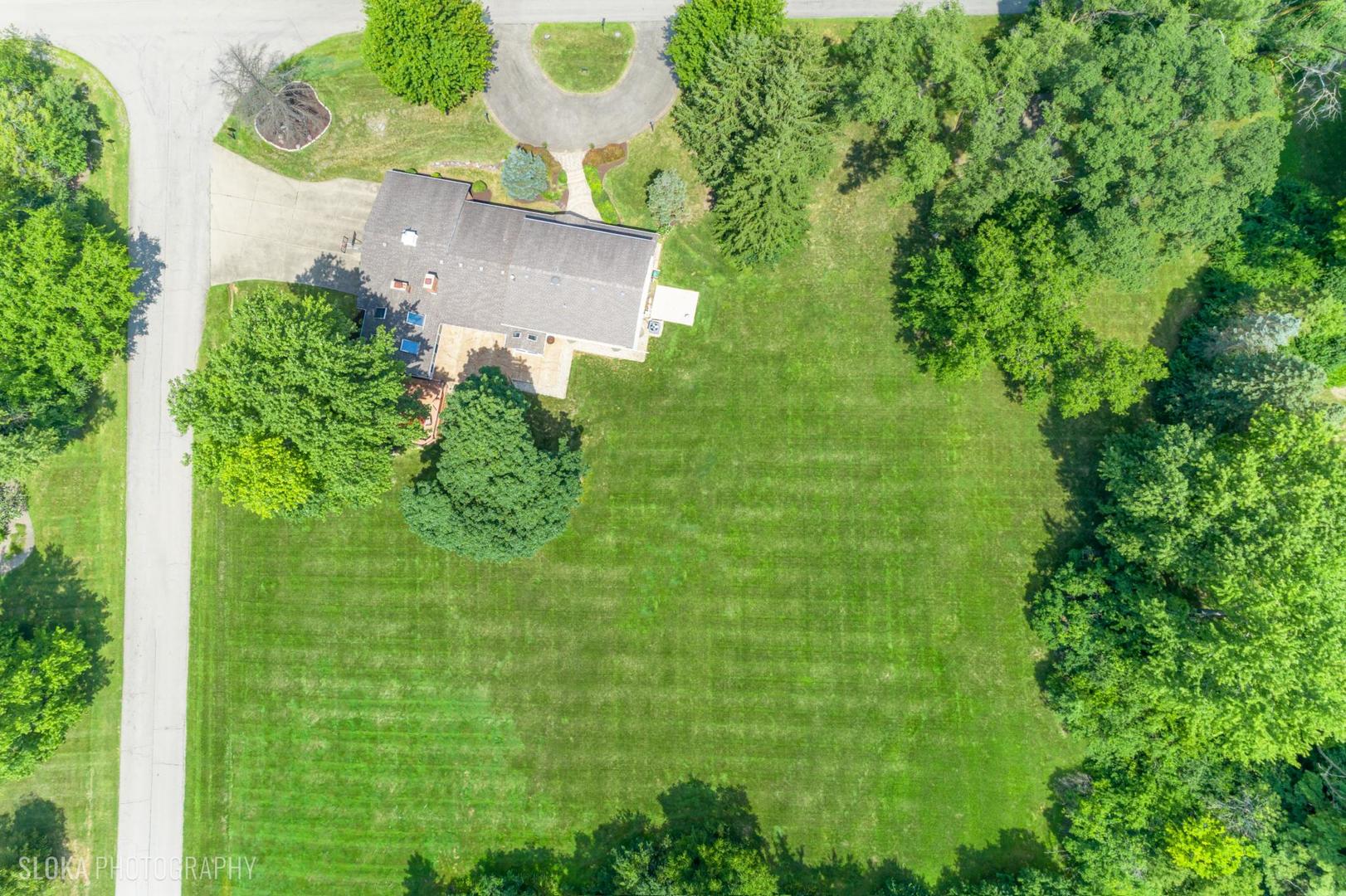 25839 West Sunset Road Barrington, IL 60010 - Photo 4 of 54 an aerial view of a house with a yard