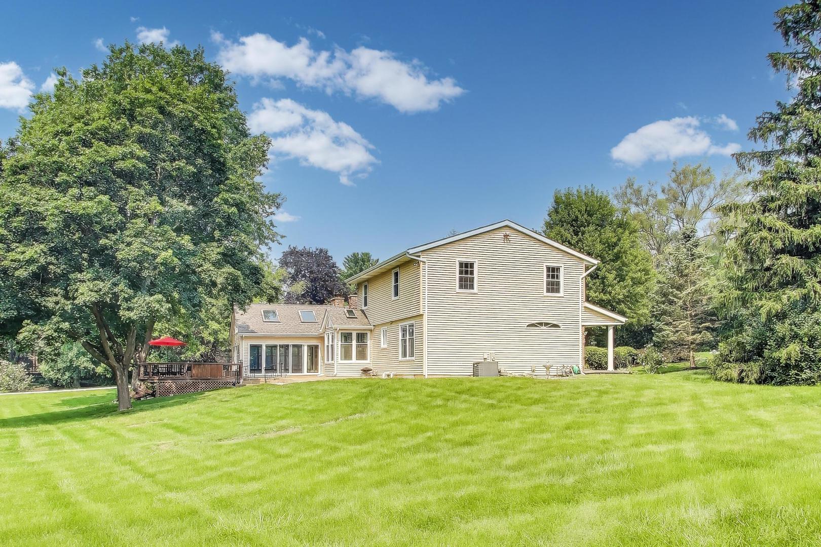 25839 West Sunset Road Barrington, IL 60010 - Photo 44 of 54 a view of a house with a yard